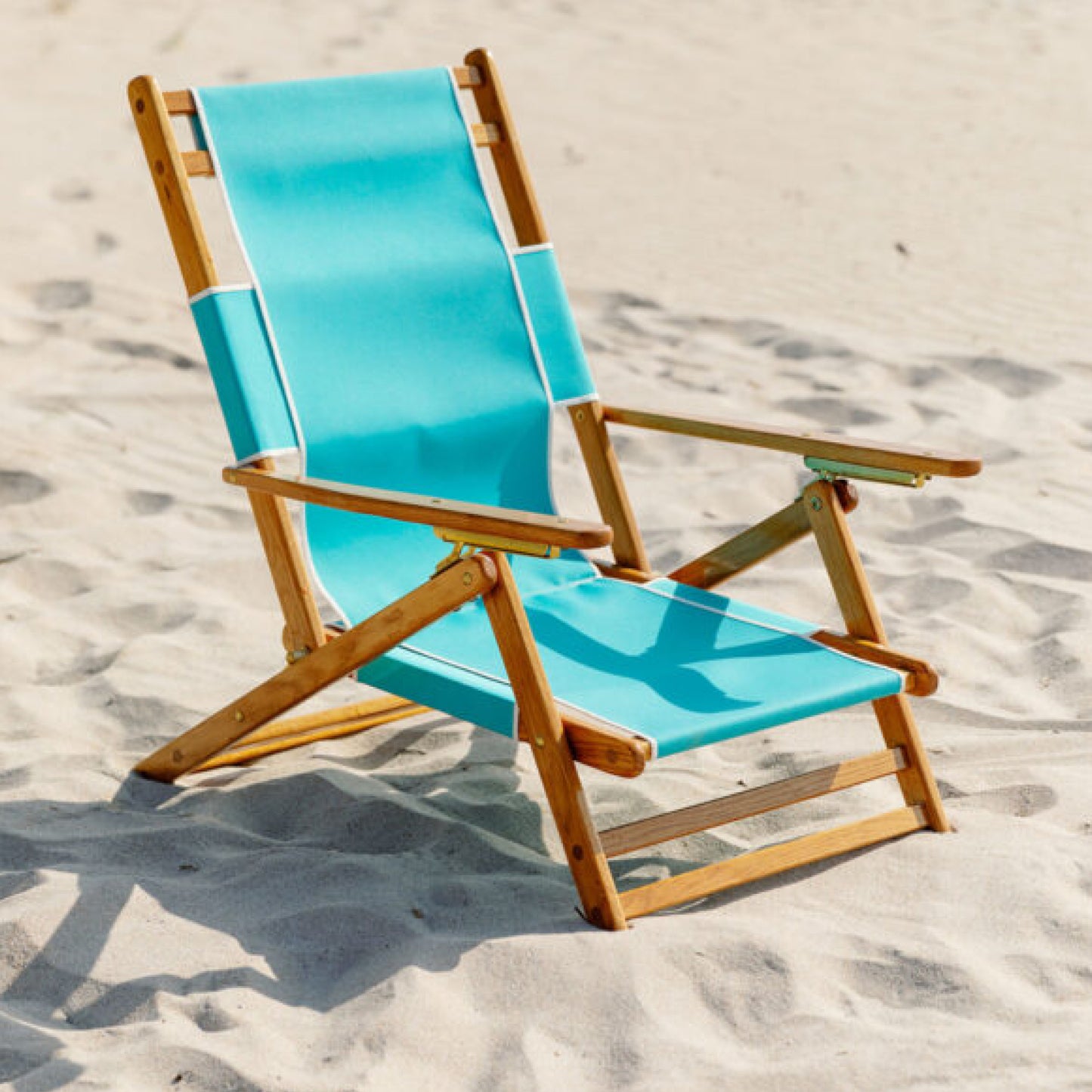 Coastsetter Lounge Chair in Aqua Marine on the sand, upright without a leg rest