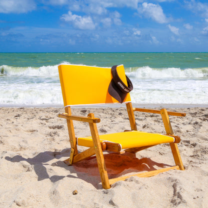 Coastsetter Sand Chair in Sunflower Yellow, sitting low to the sand