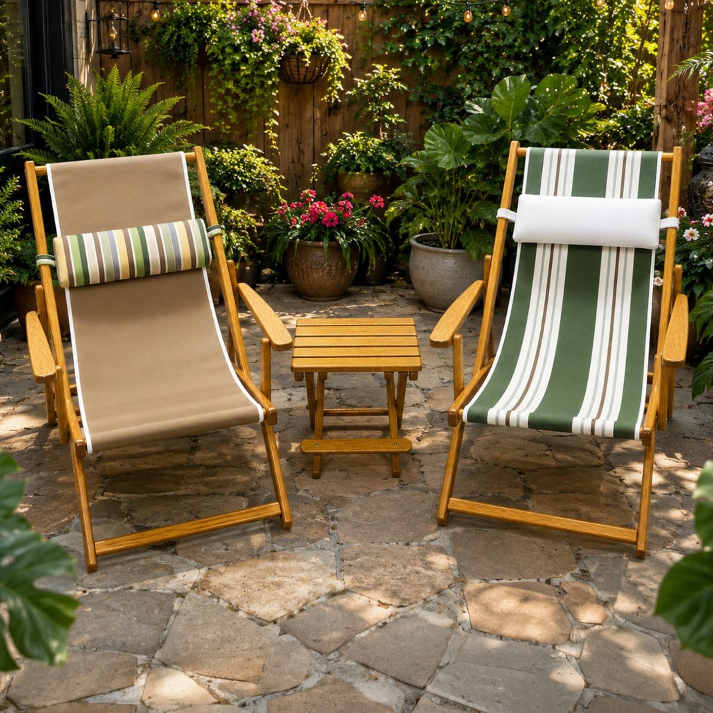 A pair of Coastsetter Sling Chairs in Sand and Green Stripes with a folding side table