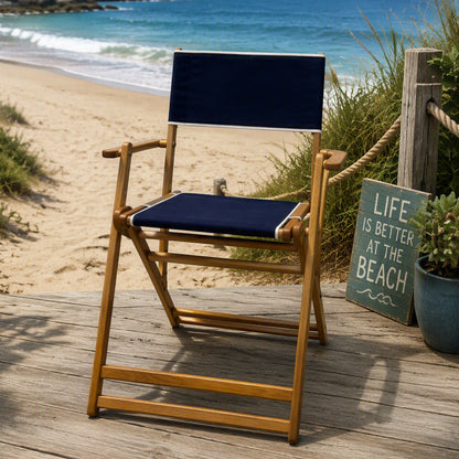 Coastsetter Outer Banks Chair in Navy set up on the sand by the dune grass