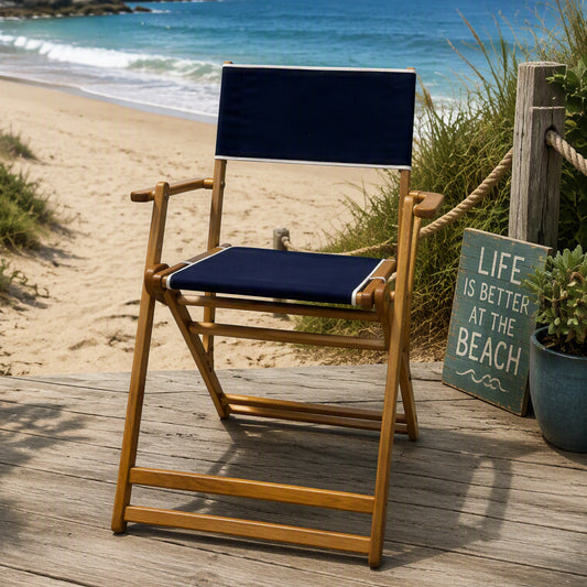 Coastsetter Outer Banks Chair in Navy set up on the sand by the dune grass