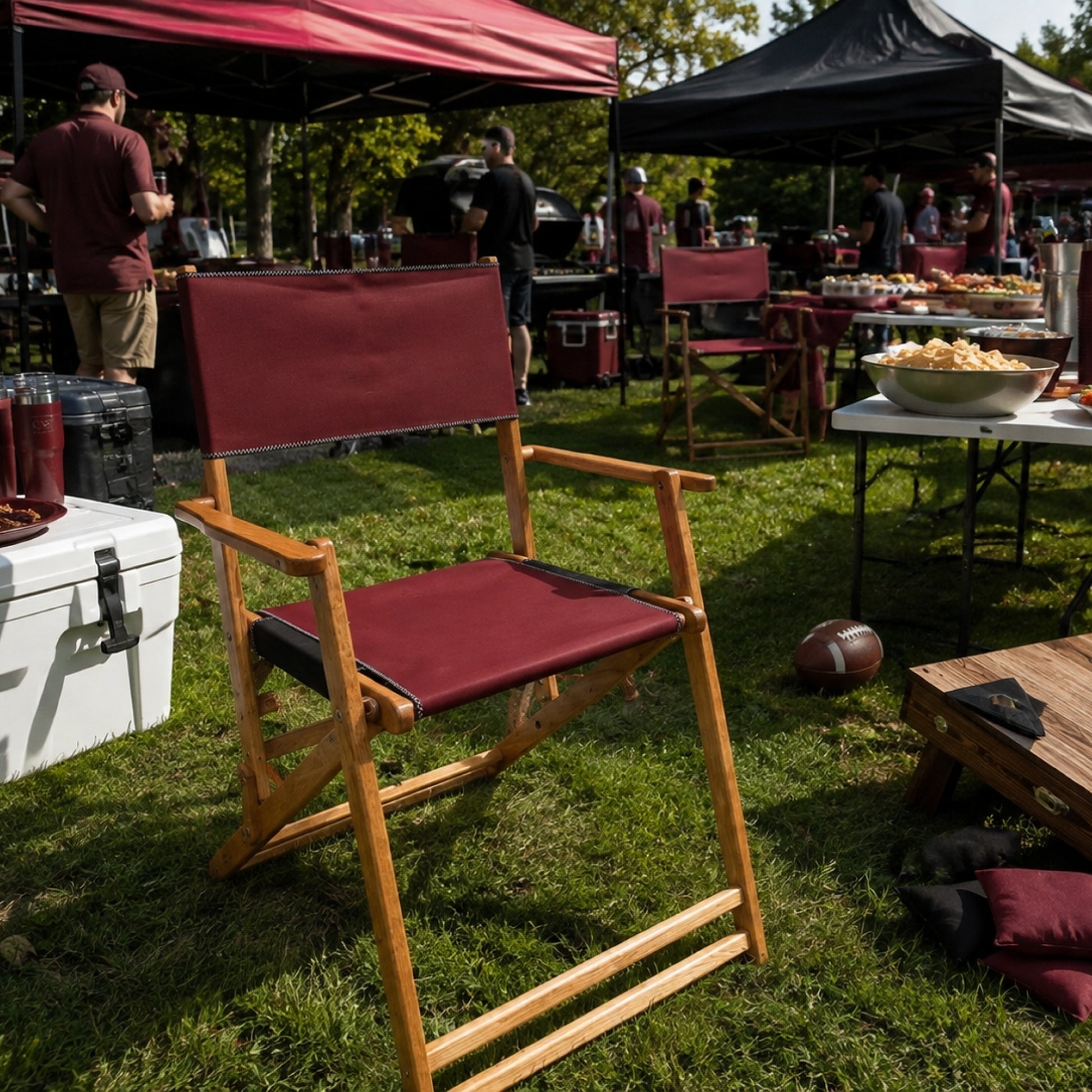 Coastsetter Tailgate Chair in burgundy and black at a tailgate