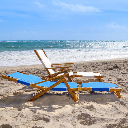 Coastsetter Lounge Chair reclined low on the sand with the leg rest extended