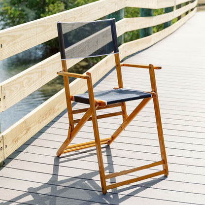Coastsetter Outer Banks Chair in Navy on a boardwalk above the beach