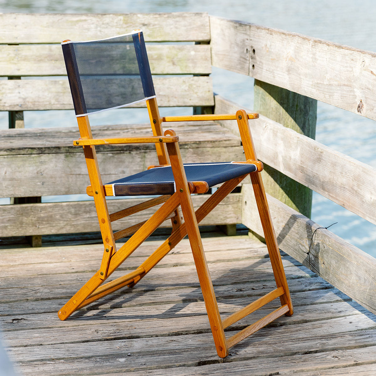 Coastsetter Outer Banks Chair in Navy on a stone patio